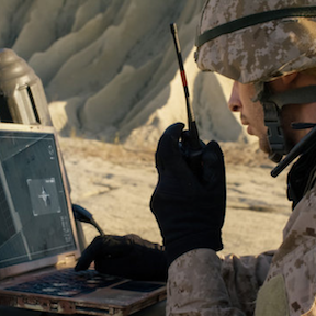 Soldier using Army Training System in the field.